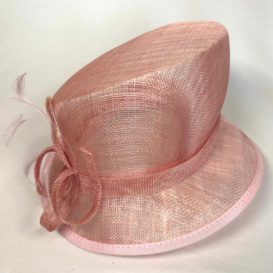 Pink occasion hat with feature bow and feather detail