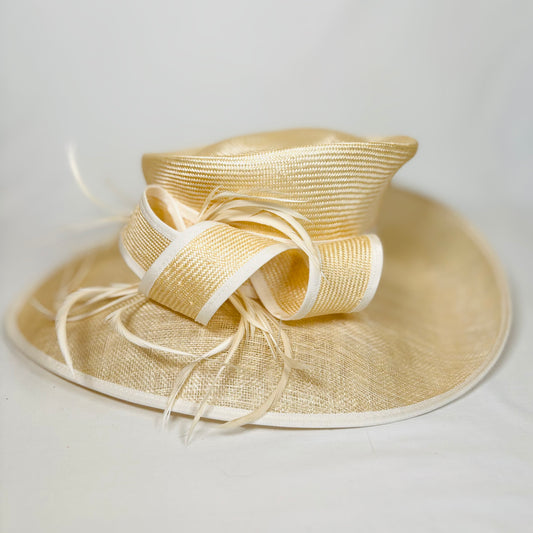 Cream straw occasion hat with light trim and statement bow design