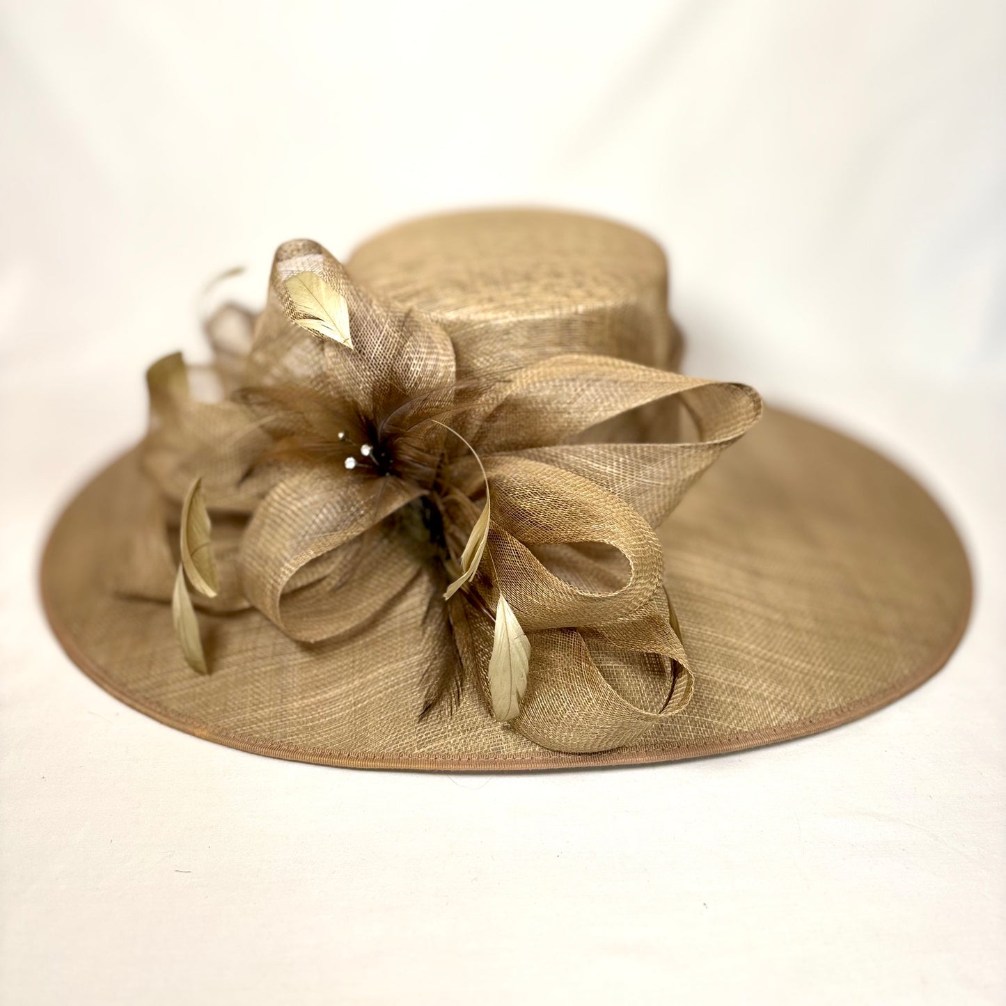 Brown wide-brim statement hat with sculptured detailing