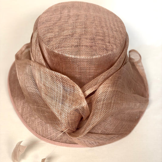 Blush occasion hat with feathered detail