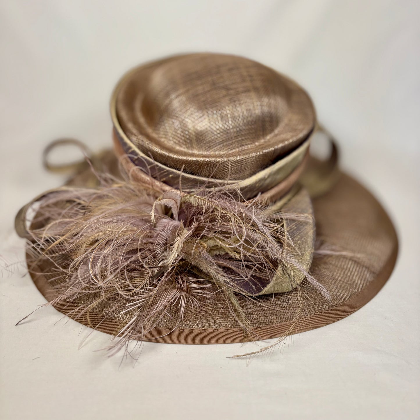 Bronze wide-brim statement hat with layered bold design