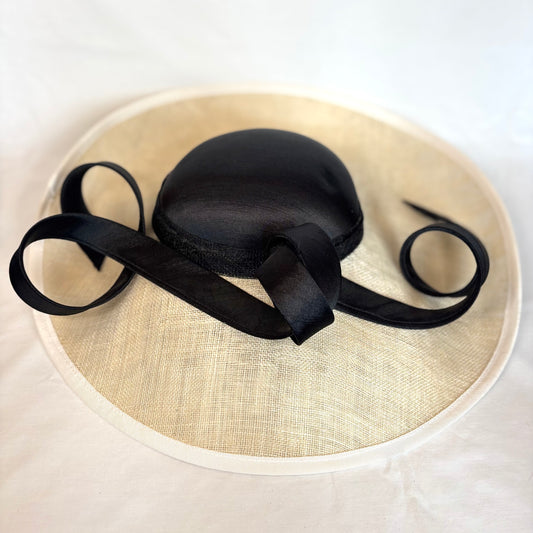 Black and White wide-brim occasion hat with structured design