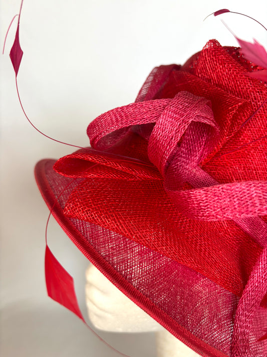 Red structured occasion hat with flower detail