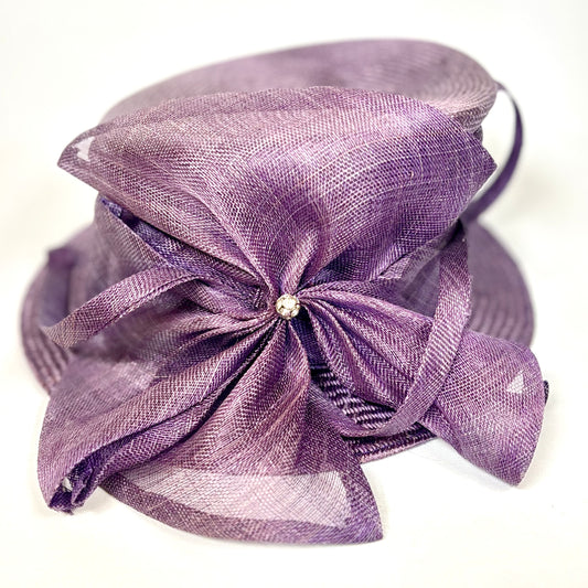 Purple occasion hat with diamante flower design