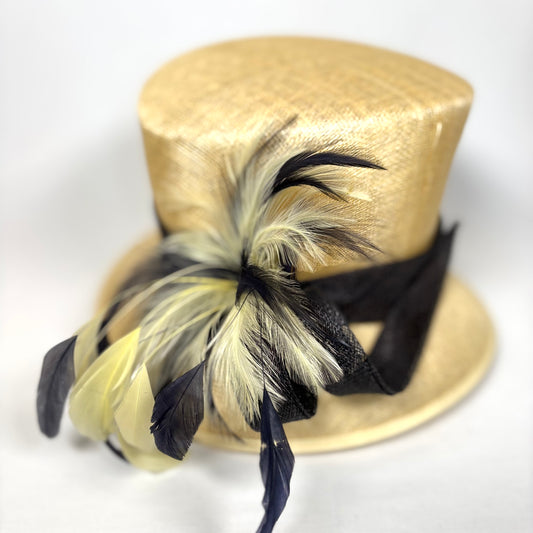 Cream and black classic style hat with statement feather detail