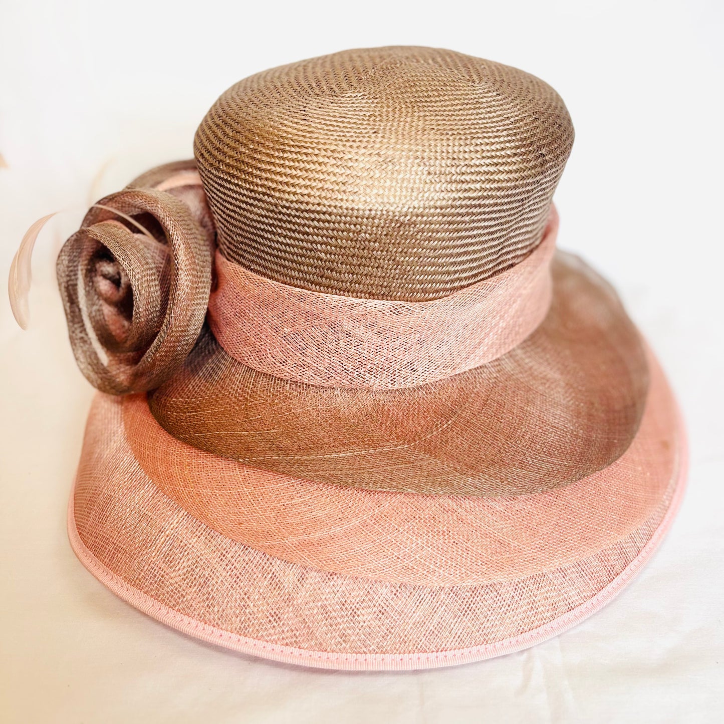 Pink two-tone occasion hat with sculpted flower design