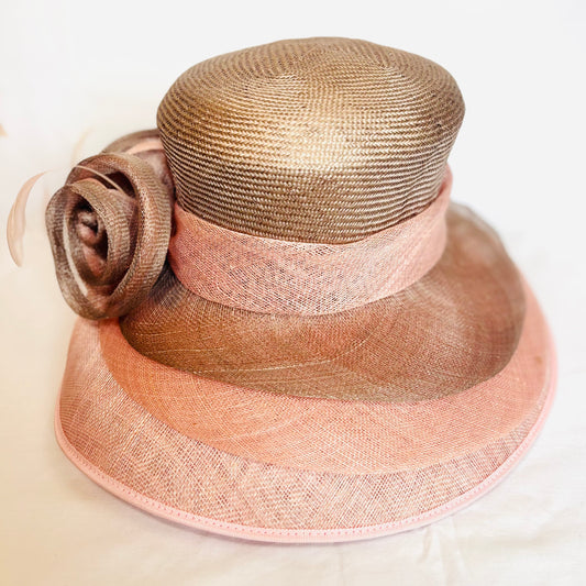 Pink two-tone occasion hat with sculpted flower design