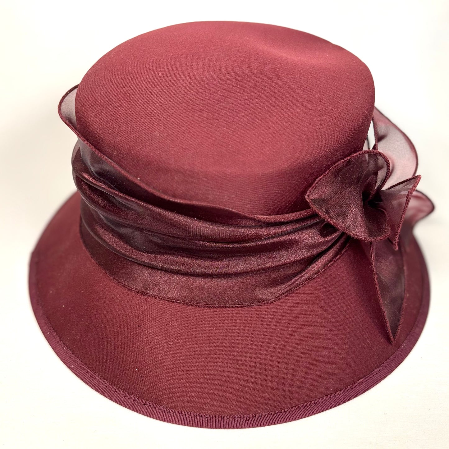 Maroon textured occasion hat with silk bow detail