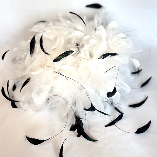 White feathered statement piece with black accent feathers