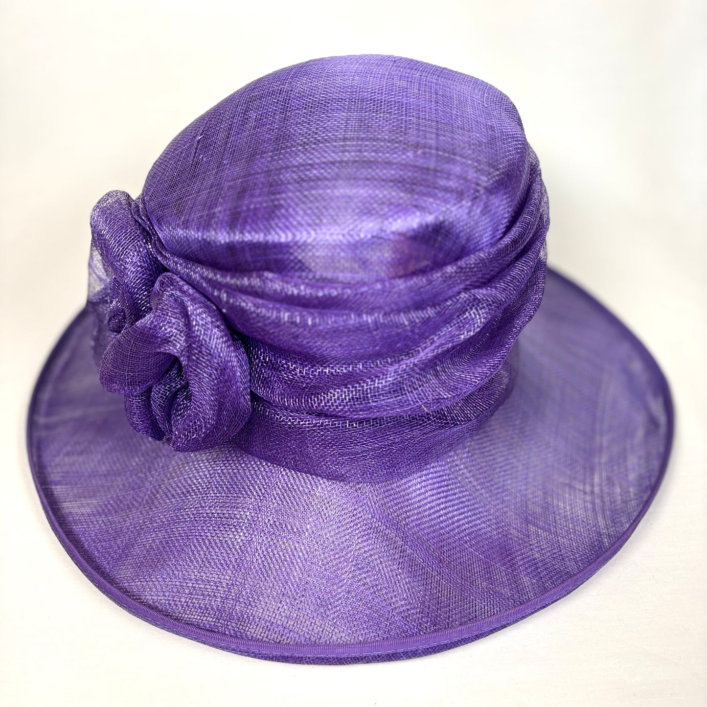 Purple disc hat with flower detail