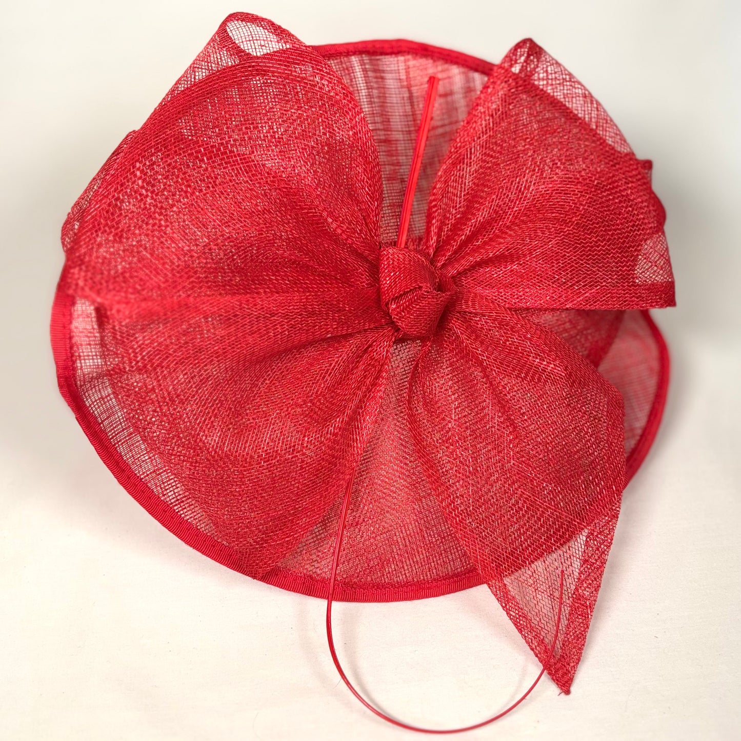 Red hatinator with bold bow design