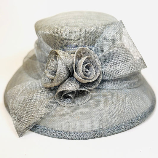 Light blue headpiece with structured rose detail.