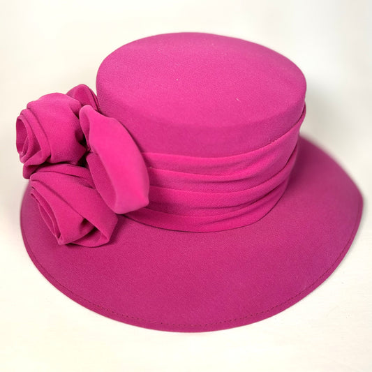 Pink occasion soft textured hat with bold flower design