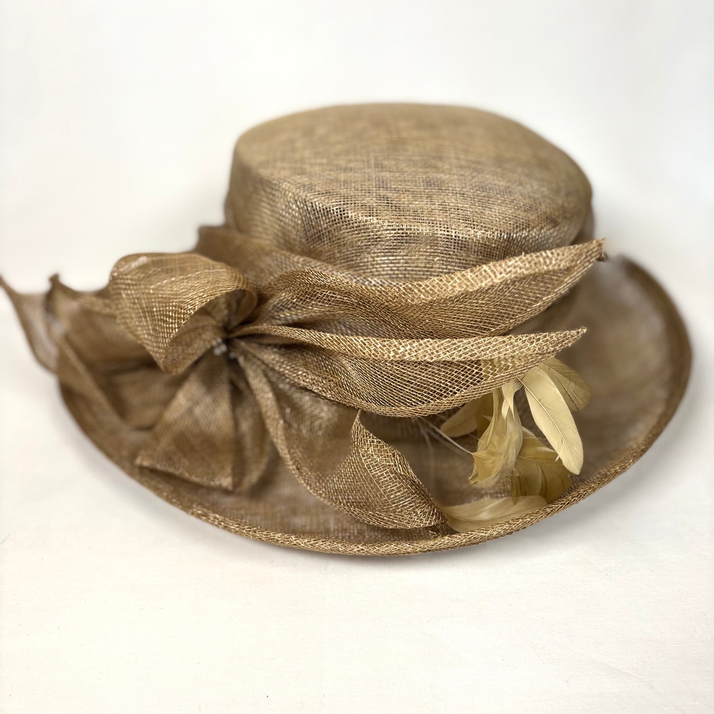 Brown occasion hat with statement flower detail