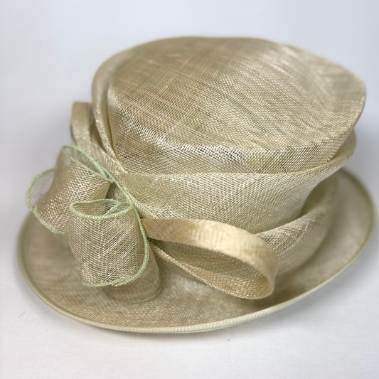 Sage green layered occasion hat with structured bow detail