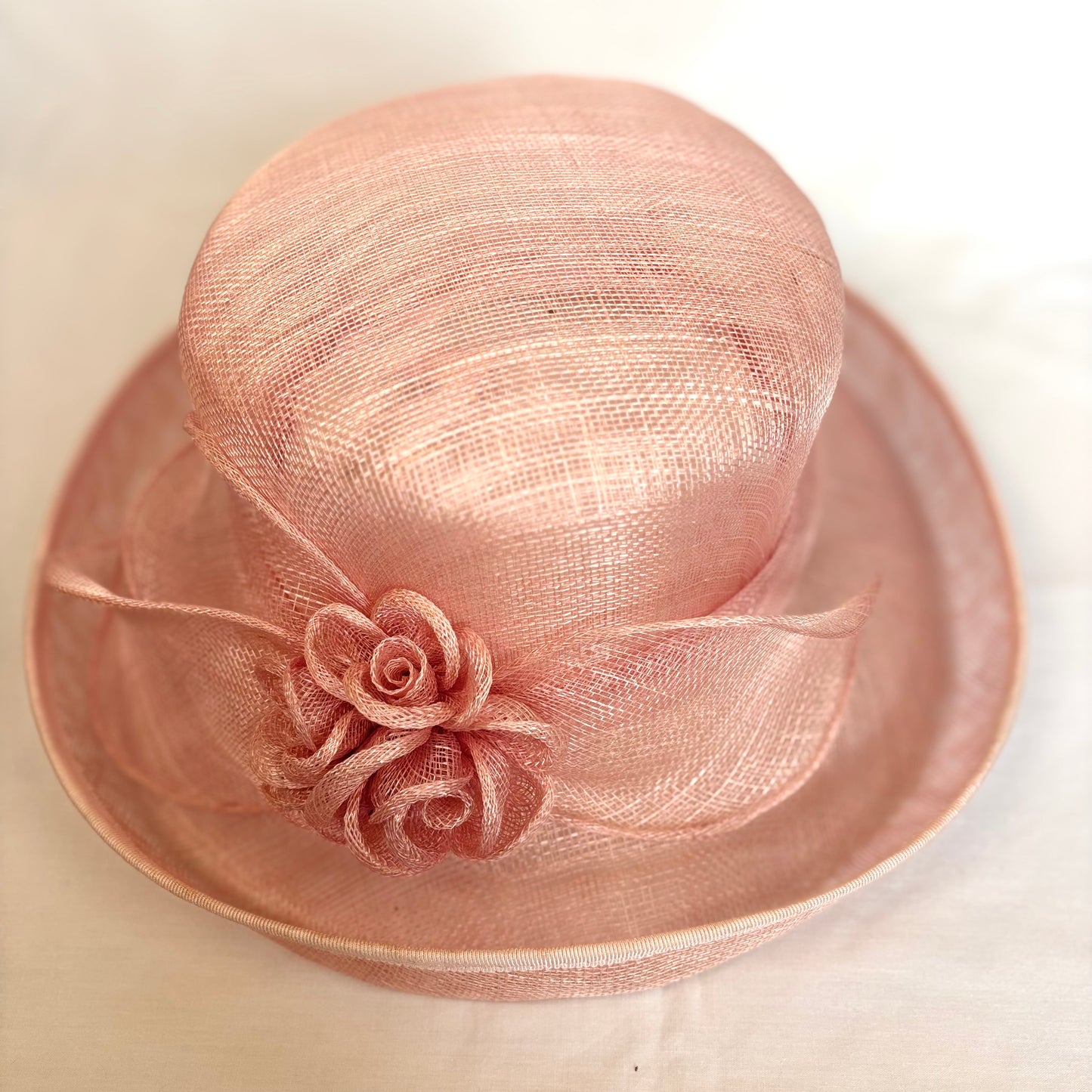 Blush pink occasion hat with flower design