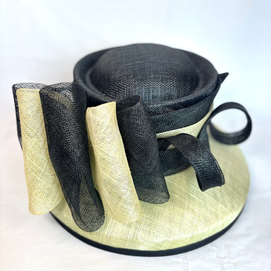 Cream and Black statement hat with bold structured bow design