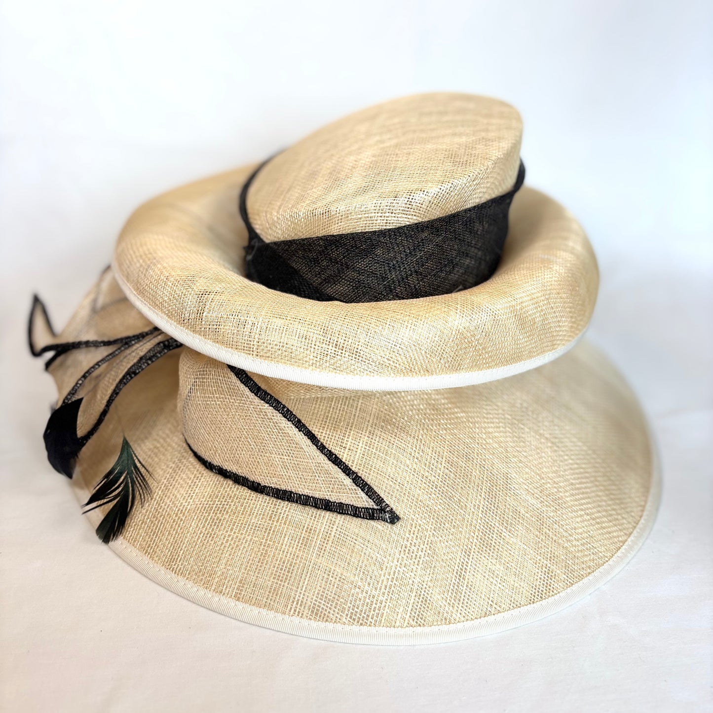 Cream and black double brim hat with statement bow detail