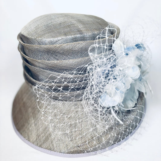 Pale blue statement headpiece with detailed bold flower design