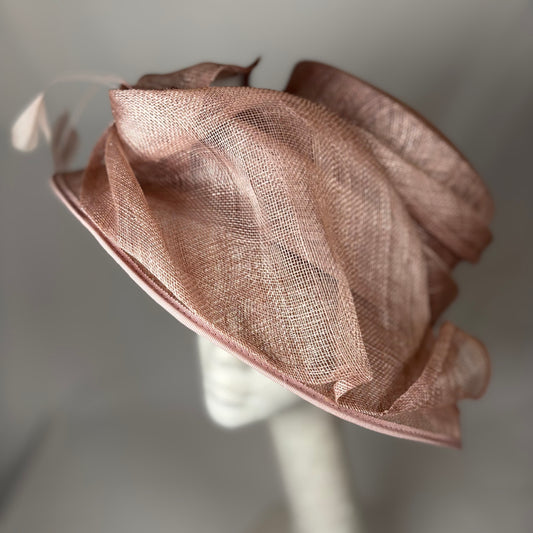 Blush occasion hat with feathered detail