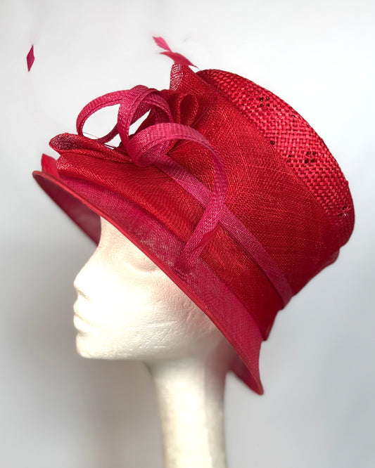 Red structured occasion hat with flower detail