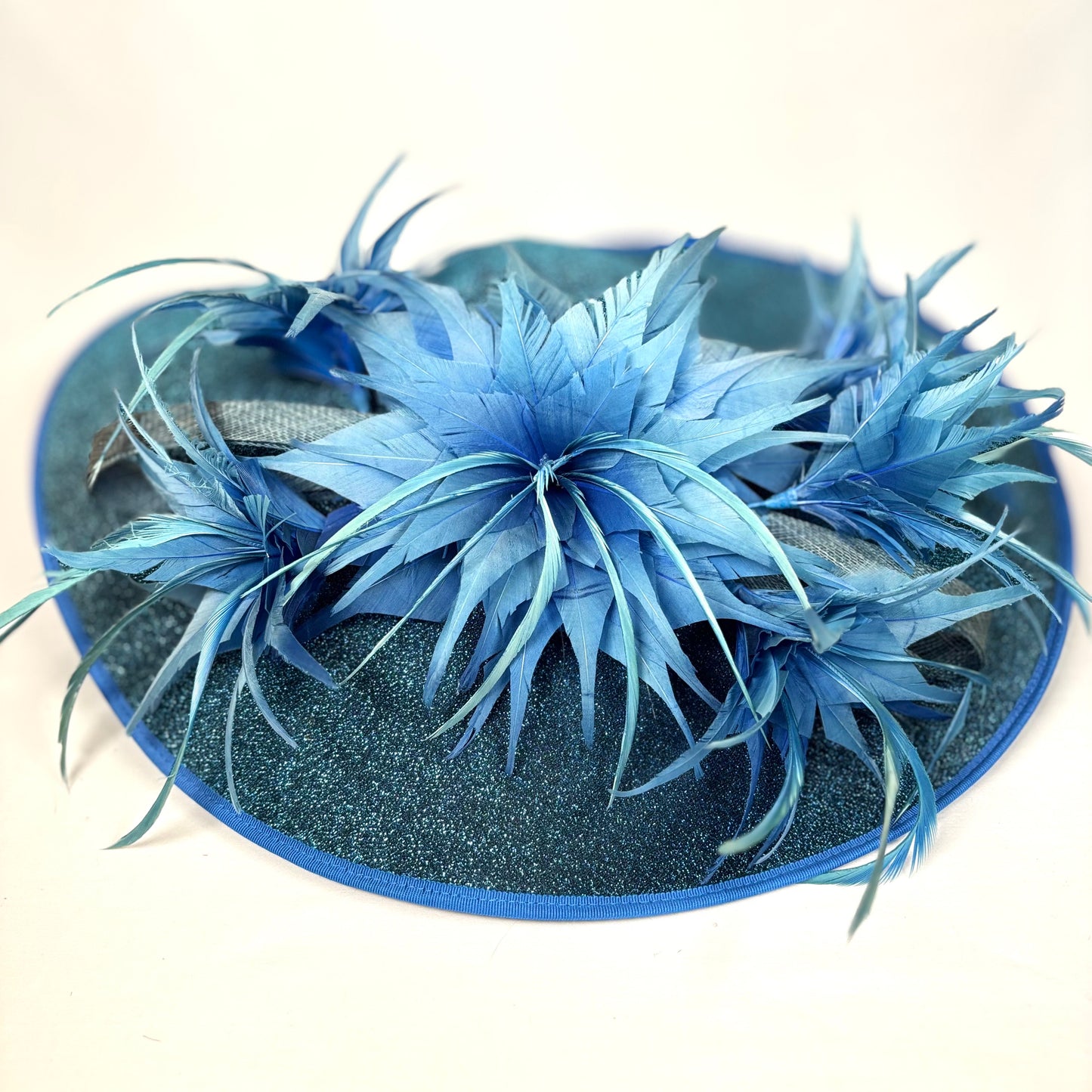 Blue feathered wide-brim occasion hat