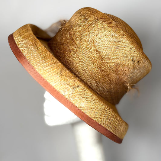 Straw headpiece in tan with trim detail