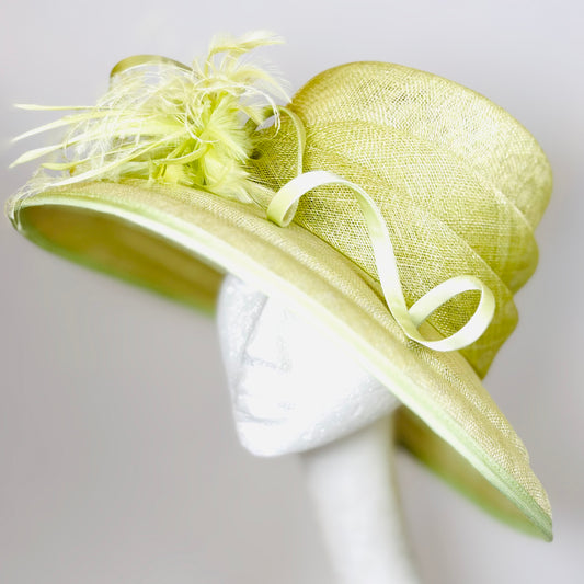 Light green wide-brim structured hat with twist and feather detail
