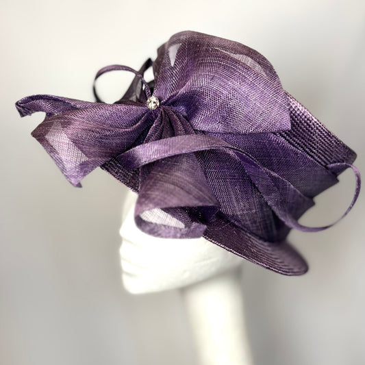 Purple occasion hat with diamante flower design