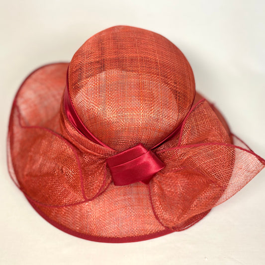 Orange wide-brim occasion hat with structured bow detail