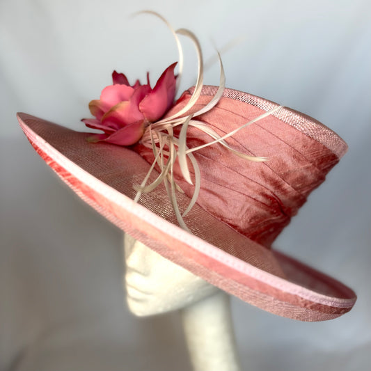 Pink occasion hat with statement flower detail