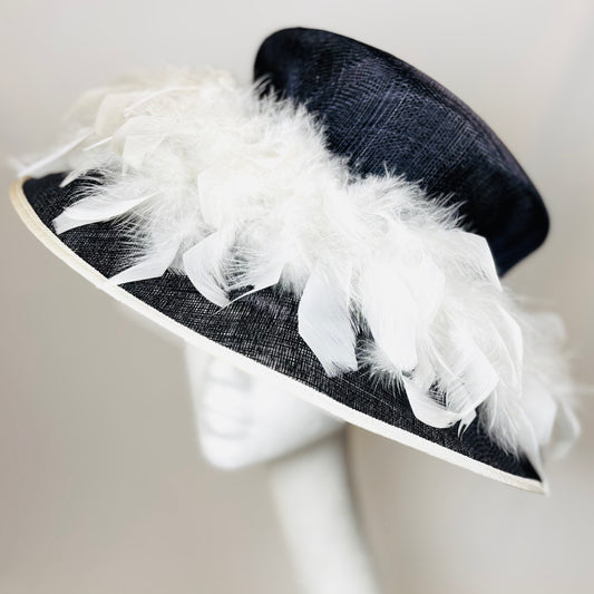 Navy occasion hat with feather design