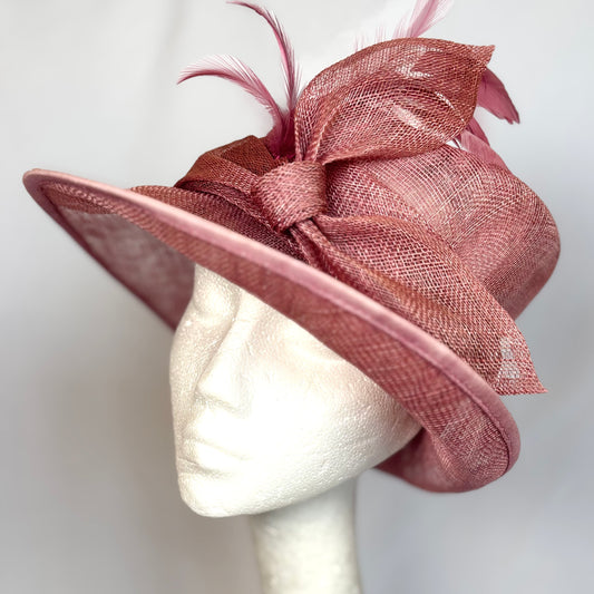Blush pink occasion hat with layered bow design
