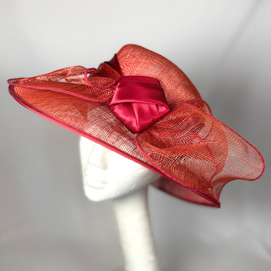 Orange wide-brim occasion hat with structured bow detail