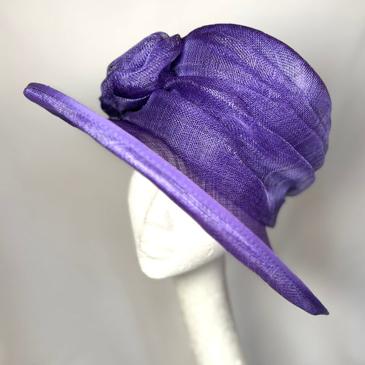 Purple disc hat with flower detail