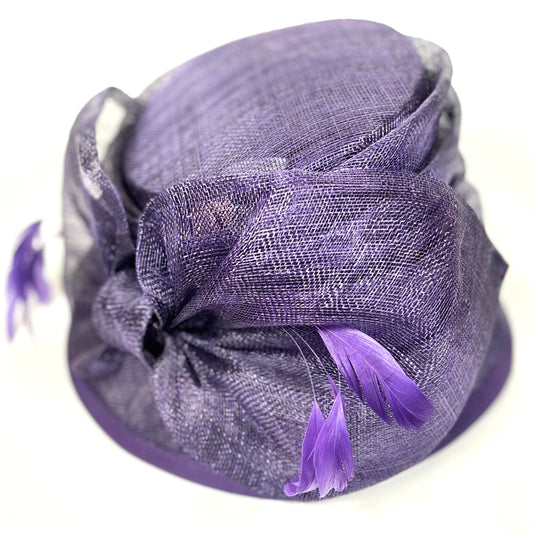 Purple occasion hat with soft feather detail