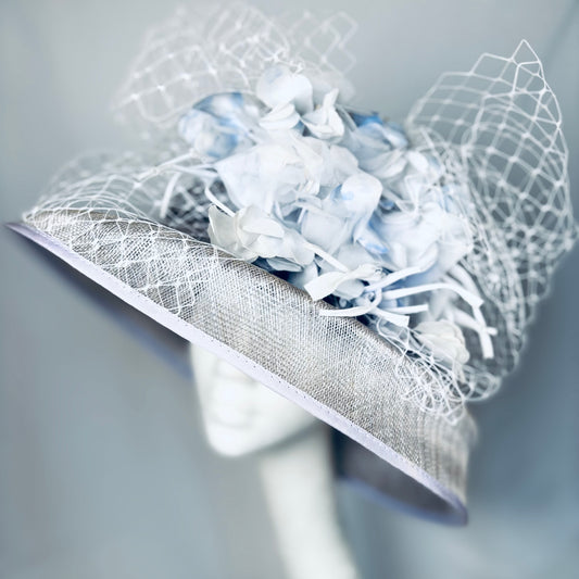 Pale blue statement headpiece with detailed bold flower design