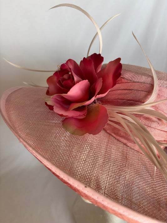 Pink occasion hat with statement flower detail