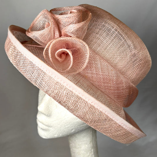 Pink occasion hat with up turn brim and flower detail