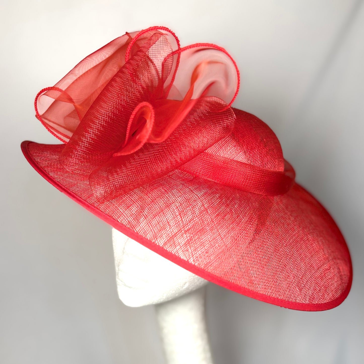 Red statement occasion hat with layered bow design
