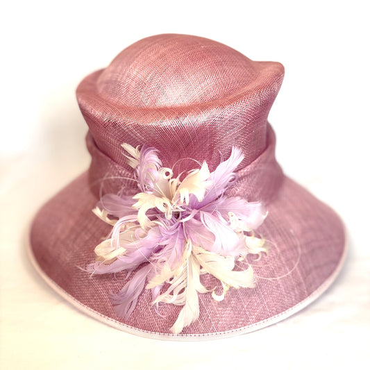 Pink structured occasion hat with feature flower design