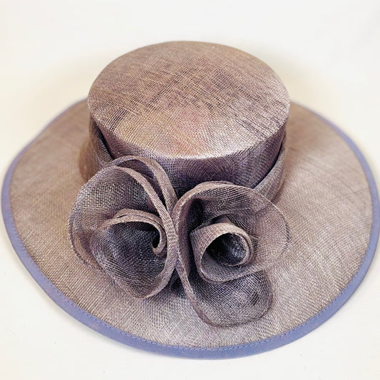 Mauve wide-brim occasion hat with feature flower design