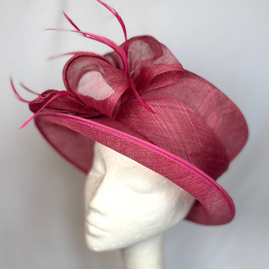 Maroon occasion hat with structured flower and feather detail