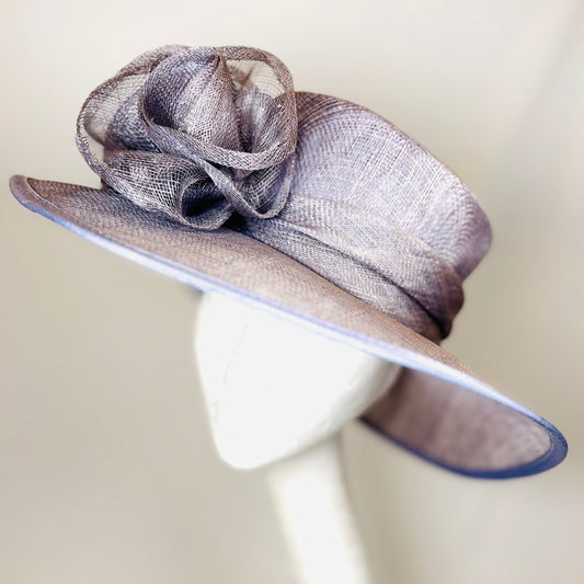 Mauve wide-brim occasion hat with feature flower design