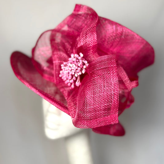 Rose coloured occasion hat with sculpted bow design