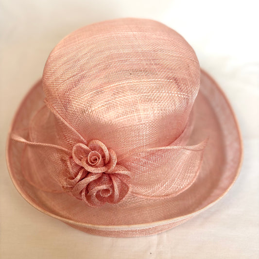 Blush pink occasion hat with flower design